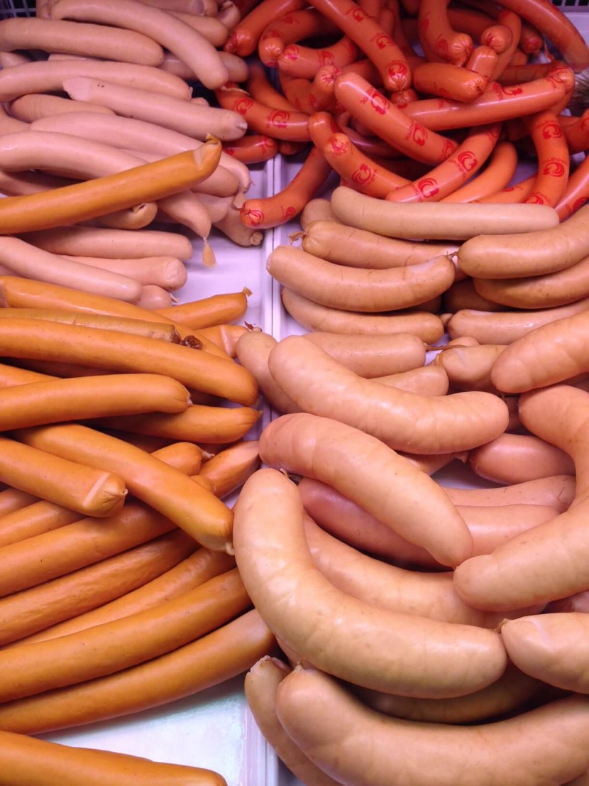 A bunch of different sausages, all in sections of length, thickness and colour