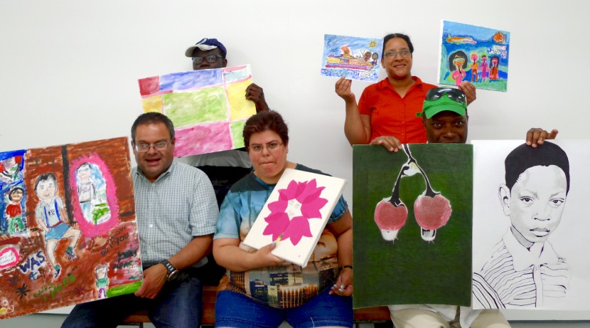 a group of five people showing off their artwork