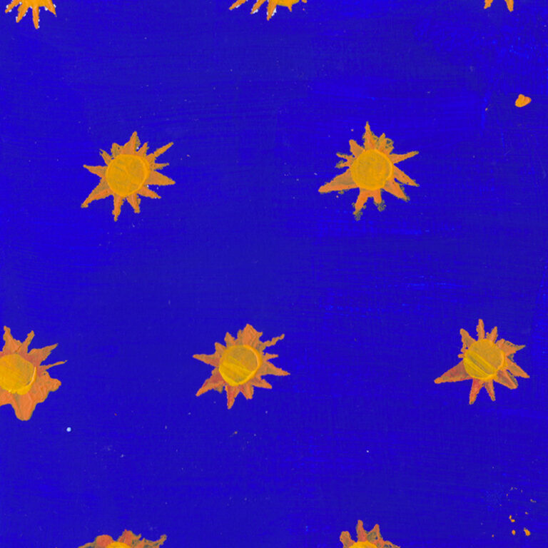 a close-up photograph of sun shapes on a dark blue background