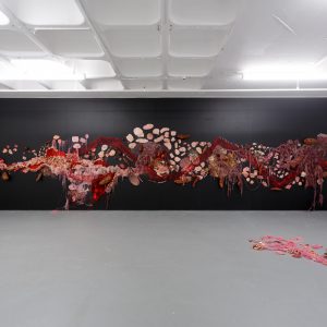 an illustration with numerous parts resembling organs painted on a wall